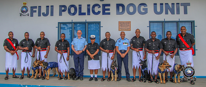 Inspector Todd Southall and Sergeant Wally Kopae with the team outside the new Fiji Police Dog Unit. The handlers are, from left: PC Isikeli Bola (Fi); PC Maciu Temo (Ngakau); PC Aminio Koto (Storm); PC Valevatu Rabuku (Wren); CPL Jone Wainiqolo (Scully); PC Maciu Sevutabua (Patrick); and PC Michael Peter (Hazza).