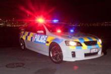 police patrol car with lights on at nightime.