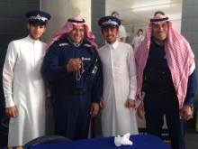 Acting Senior Sergeant Joe Aumua and Constable Sotiaka Roma with Saudi students at the Eid celebration at Eden Park