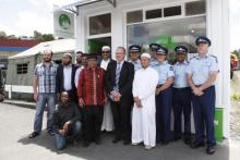 Constable Saifudin Abu (in white) with local MP Ian McKelvie, Police colleagues and members of the Muslim community including FI