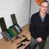 Arms officer Richard Plas with arms and ammunition surrendered