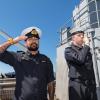 Members of the diving support vessel HMNZS MANAWANUI performing a ‘Piping of the Side’ as a mark of respect