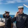 Members of the diving support vessel HMNZS MANAWANUI performing a ‘Piping of the Side’ as a mark of respect