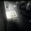 The alleged offender is the man in the top right, facing the camera with his shirt unbuttoned.