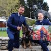 Constable Seaton McGuigan (right), Dunedin Police, and his winning Police Dog Trust calendar entry with the image stars, Constab