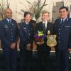 Inspector Rakesh Naidoo, Senior Constable Elizabeth Young and Deputy Commissioner Haumaha with the winner, Robbie White