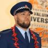 Constable Milford stands at attention during inspection on graduation day.