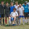 Players line up for a photo after the Communities Football Cup