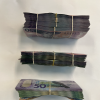 Cash recovered from an envelope labelled 'drugs profit'