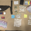 A firearm, ammunition, cash and methamphetamine were among the items located