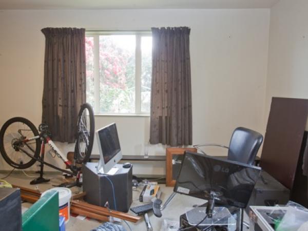 Another view of a room at the address where sound equipment and a bike were located