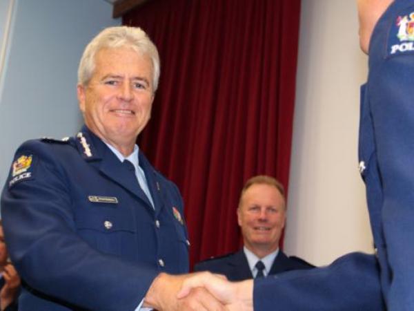 Commissioner Peter Marshall welcomes a new constable into the ranks.