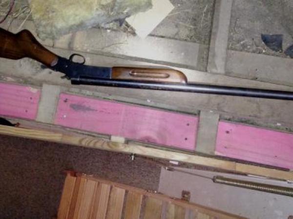 A shotgun seized by Police in the search 