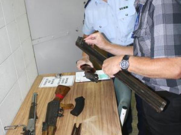 Eye for detail: Constable Maree Fouhy and Arms Officer Richard Plas check firearms serial numbers