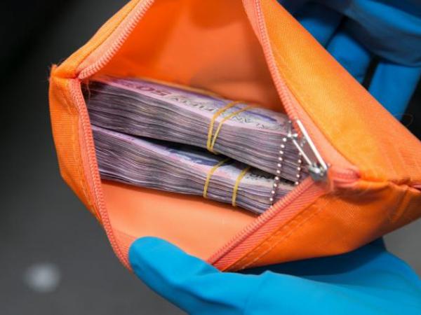 An amount of cash seized by Police.