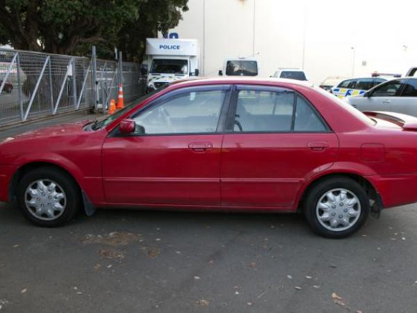 Red Mazda Familia