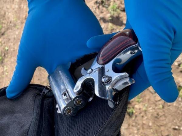 A pistol found at one of the properties searched