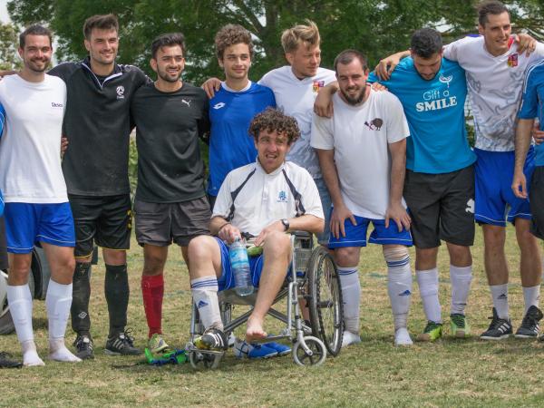 Players line up for a photo after the Communities Football Cup