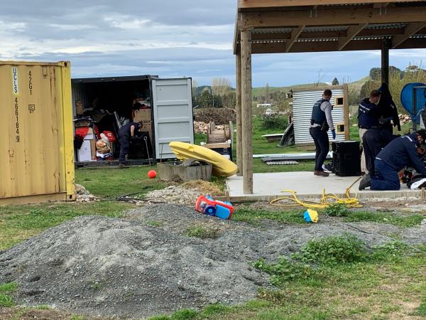 Police staff search a property in Wairoa today