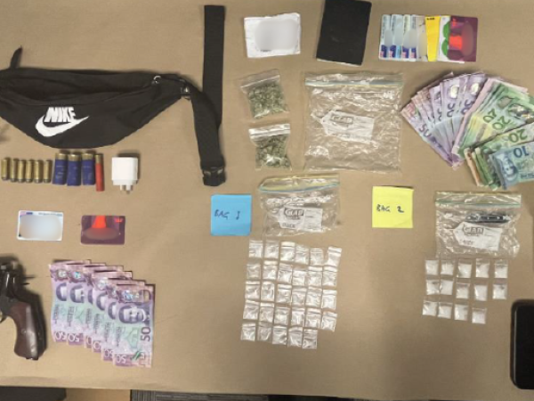 A firearm, ammunition, cash and methamphetamine were among the items located