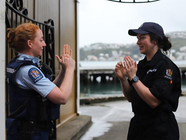 Detective Ros Newson and Constable Stephanie Cox signing.