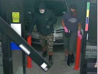 The armed offenders entered the Gull Service Station in Greville Road, North Shore.