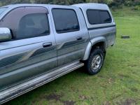 2004 silver/grey-coloured Toyota Hilux