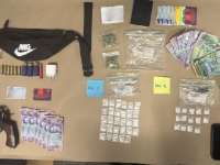 A firearm, ammunition, cash and methamphetamine were among the items located